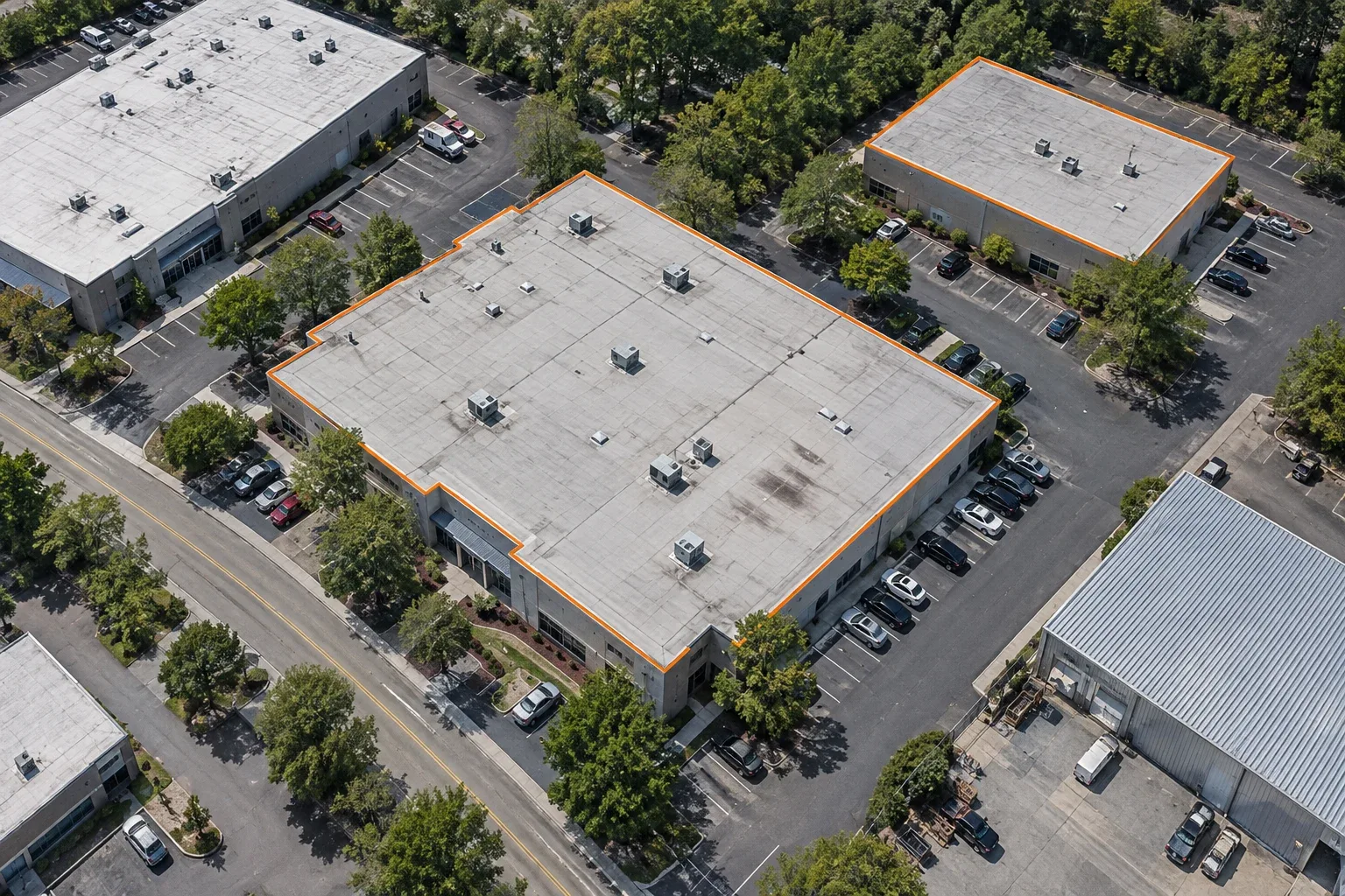 Aerial view of commercial roofs with rooftop equipment