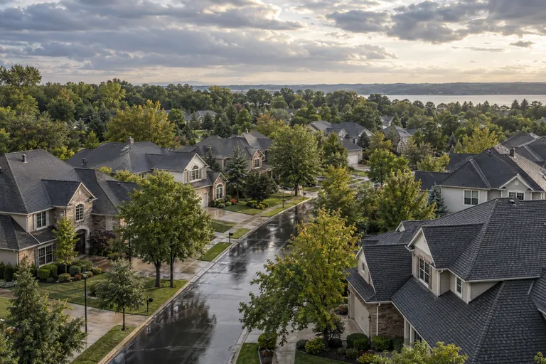 Illustrative neighborhood after rain, with intact roofs
