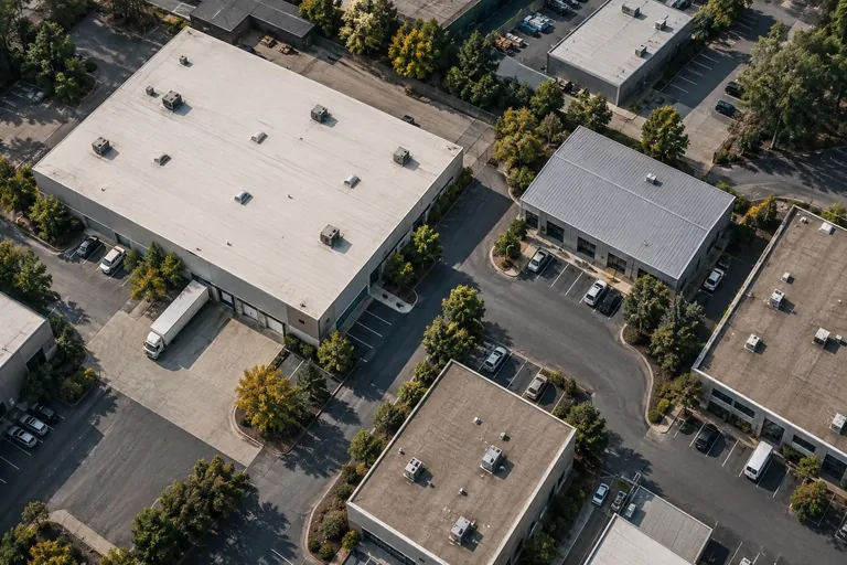 Illustrative commercial district with membrane and metal roofing systems